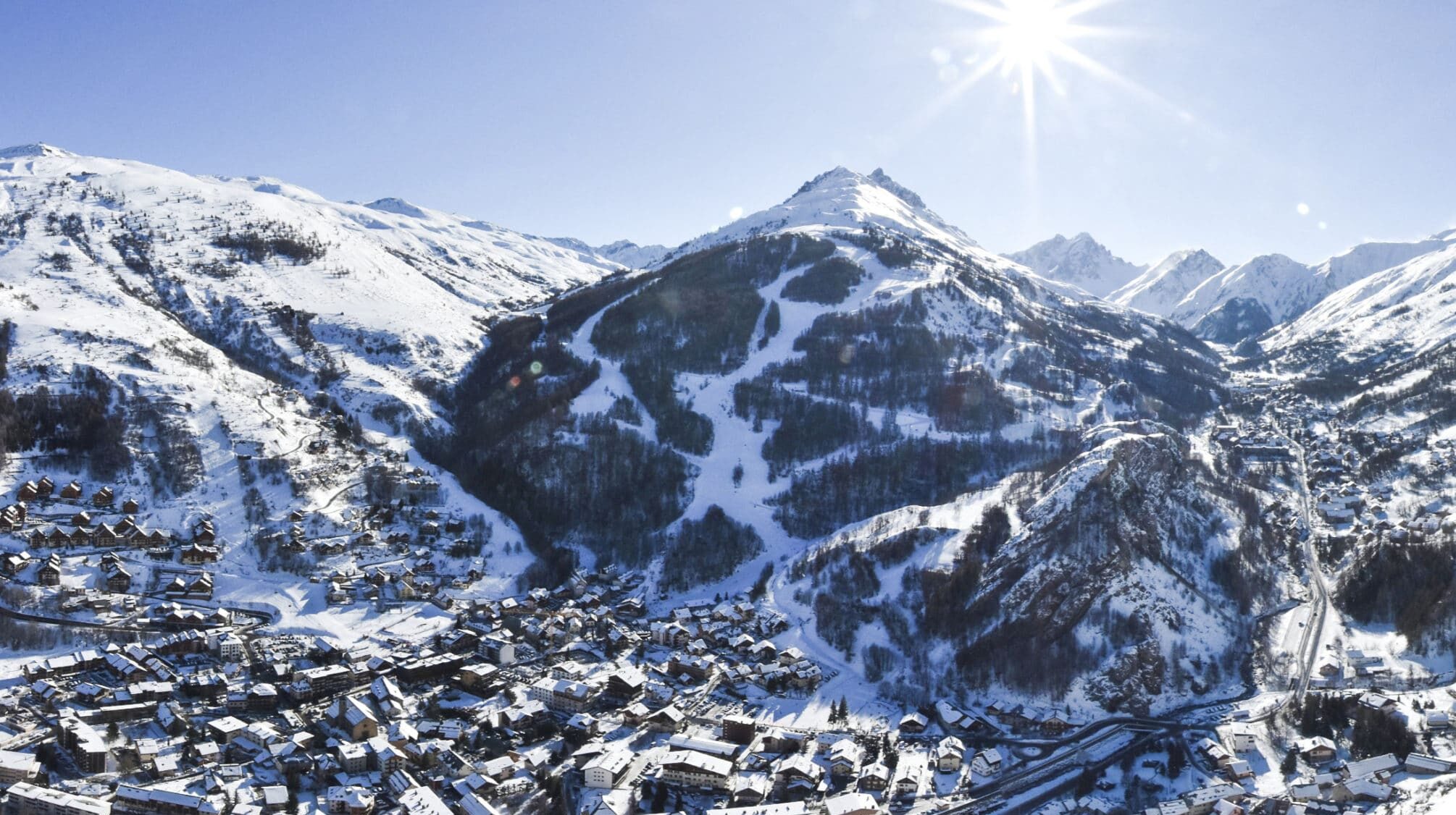 Valloire village in winter — snow sculptures, ice rink and baroque church
