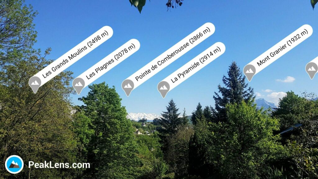 PeakLens augmented reality app showing mountain names overlaid on a real Alpine view